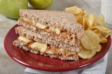 Peanut butter sandwich with potato chips