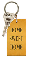 Clé de maison sur plaque dorée 