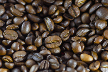 Coffee beans closeup. Roasted coffee beans background. Horizontal macro photography