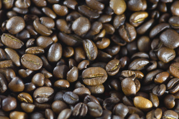 Coffee beans closeup. Roasted coffee beans background. Horizontal macro photography
