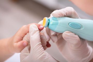 Mother Cutting Her Baby Finger Nail