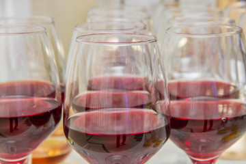 Glasses with red wine on the table close up