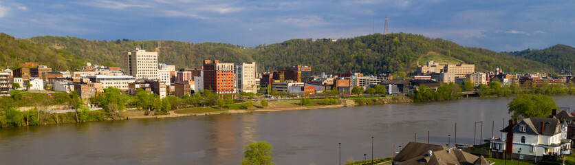 Fototapeta na wymiar The Ohio River Meanders by Reflecting Buildings of Wheeling West Virginia