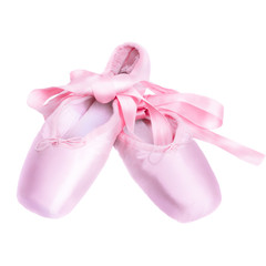 Pointe shoes ballet dance shoes with a bow of ribbons beautifully folded on a dark background.