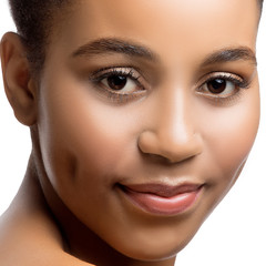 Close-up beauty face of young african woman with perfect skin, nude natural make-up