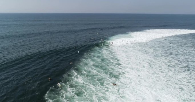 Surfer riding wave. 