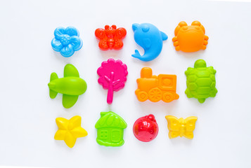 Toys for sand. Children's toy summer sea game. Flat lay. Rainbow color. Kindergarten playground on...