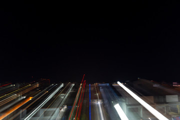 Colourful of zoom blur effect lights of city at night time background. Zoom blur effect of lights over Songkhla city Thailand.