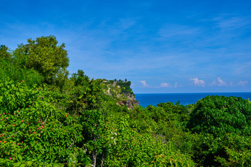 View of Uluwatu cliff with pavilion and blue sea. Bali, Indonesia.