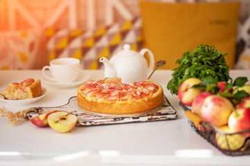 Homemade cheesecake with fresh apples and mint for dessert. Healthy organic summer dessert pie. Fresh fruit cake with homemade granola for healthy vegan diet vegetarian organic food.