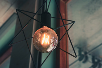 Abstract lamp hanging on ceiling vintage style.