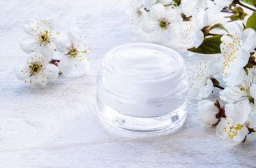 Natural face cream with spring flowers, cherries.