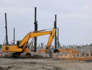 Machine used for building foundation work in large construction site at Thailand, Space for text in template