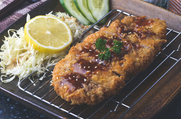 Deep fried pork  or Japanese tonkatsu.