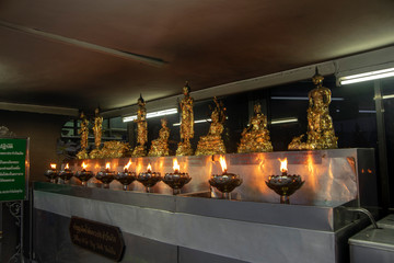 Oil lamps at the City Pillar Shrine, Bangkok, Thailand