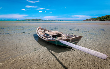 Fototapeta na wymiar Fishery wooden boat at the shore.