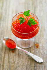 Glass with delicious red caviar