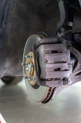 Fototapeta premium Image of a brake disc and its brake caliper