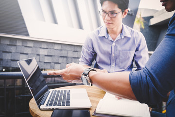 Discussing plan and idea to improvement strategy, businessmen brainstorming for strategy of business investment,businessmen review chart and document of investment information