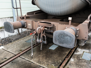 Buffers and Chain Coupler on a Standard Gauge Railway Wagon Painted Brown