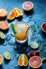 Summer cocktail with crashed ice, juicy summer drink with citrus fruits