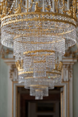 The crystal pendant lamps in a hall.