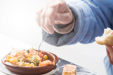 Woman eating salad on the terrace of the restuaranate