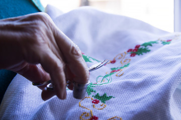 Close-up of woman's hand stitching