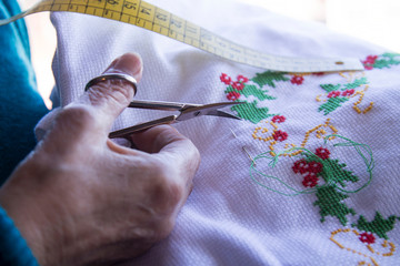 Close-up of woman's hand stitching