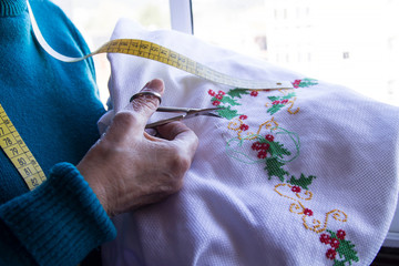 Close-up of woman's hand stitching