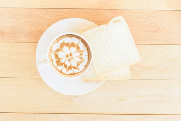 Hot coffee with slice bread in disk / hot cappuccino with slice bread for breakfast