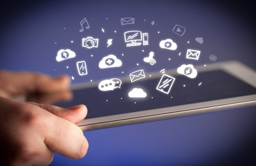 Hand holding tablet with social media concept
