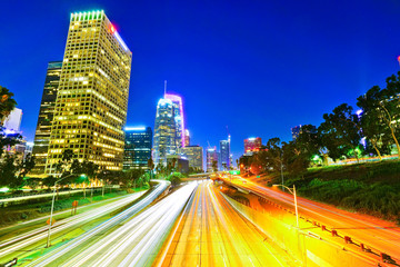 Fototapeta na wymiar View of the office buildings and main roads in the financial district in Los Angeles at night.