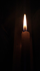 Candle light in dark background, light of hope, faith, belive, worship