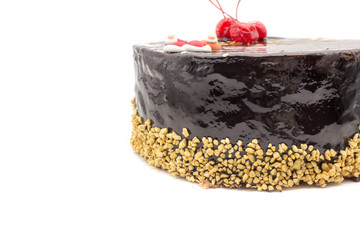 Delicious chocolate cake, decorated cherries, and sugar Santa and crispy nuts, an isolated on a white background. Cake with a copy space area.