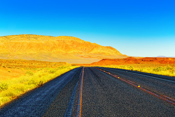 Fototapeta na wymiar Endless American asphalt roads in Arizona state.