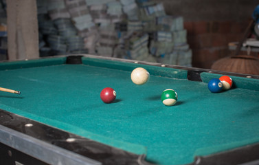 Billiards balls and cue on billiards table. Billiard sport concept