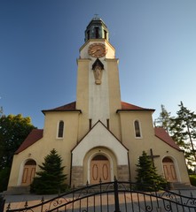 Obraz premium St. Katharina von Alexandria Roman Catholic Church in Dobrzen Wielki, district Opole built 1933-1934 and consecrated on October 4, 1934, in golden sunlight from July 6, 2014, Poland