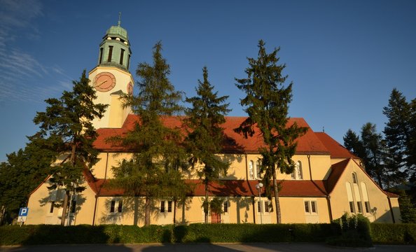 St. Katharina von Alexandria Roman Catholic Church in Dobrzen Wielki, district Opole built 1933-1934 and consecrated on October 4, 1934, in golden sunlight from July 6,  2014, Poland