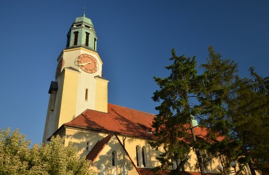St. Katharina von Alexandria Roman Catholic Church in Dobrzen Wielki, district Opole built 1933-1934 and consecrated on October 4, 1934, in golden sunlight from July 6,  2014, Poland