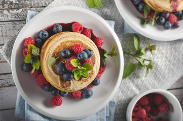 Pancakes with forest fruit sauce