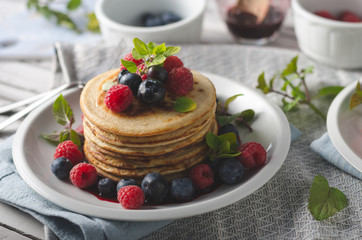 Pancakes with forest fruit sauce