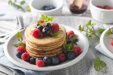 Pancakes with forest fruit sauce