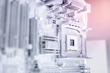Close up of silver computer mainboard or metallic electronic circuit board. Use for background or backdrop in futuristic hardware technology concept