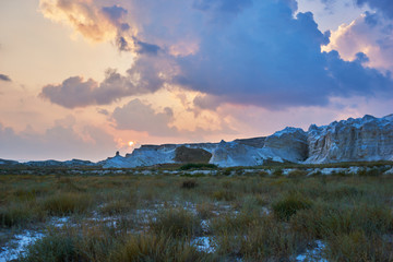 Colorful sunset in desert. Spectacular landscape with sundown desert in East Asia Chinese northwest...