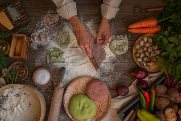 Process of making cooking homemade pasta. Chef make fresh italian traditional pasta. Flat lay. Top view. Frame. Rustic style, toned image.