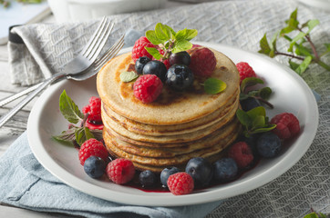 Pancakes with forest fruit sauce