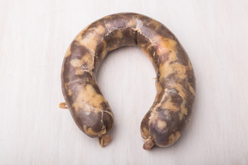 Food, national cuisine and delicious concept - sausage made with horse meat