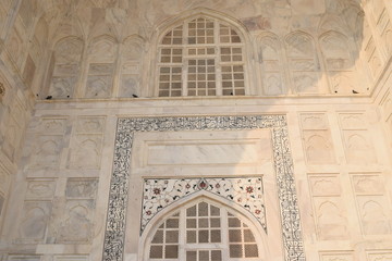 Detailed picture of exterior design of Taj Mahal with calligraphy of  Arabic Ayaat in Agra India