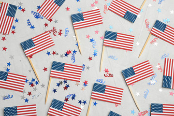 Obraz premium Flat lay composition with USA flags on color background. Happy Independence Day